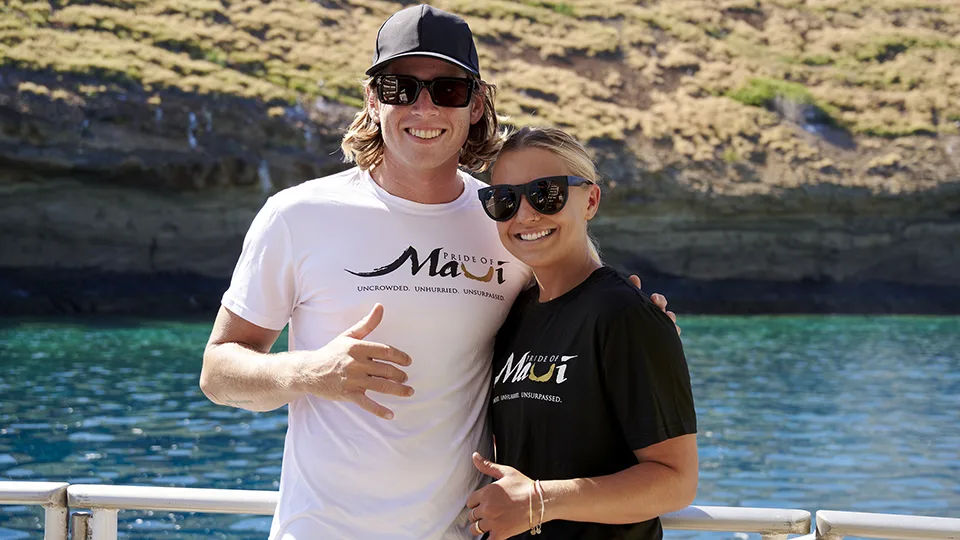 Two Pride of Maui Crewmembers Smiling and Posing