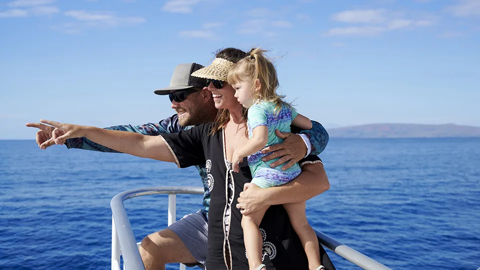 Family on Deck of Pride of Maui Looking out over the Water