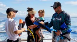 Pride of Maui Crewmember helping Family with Snorkeling Equipment