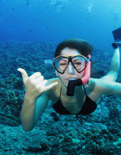 Guest Snorkeling Underwater Giving a Shaka