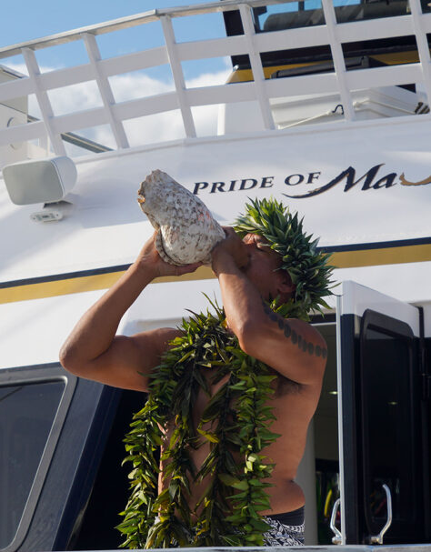 Performer Blowing Conch Shell on Pride of Maui 'Elua Wedding Cruise
