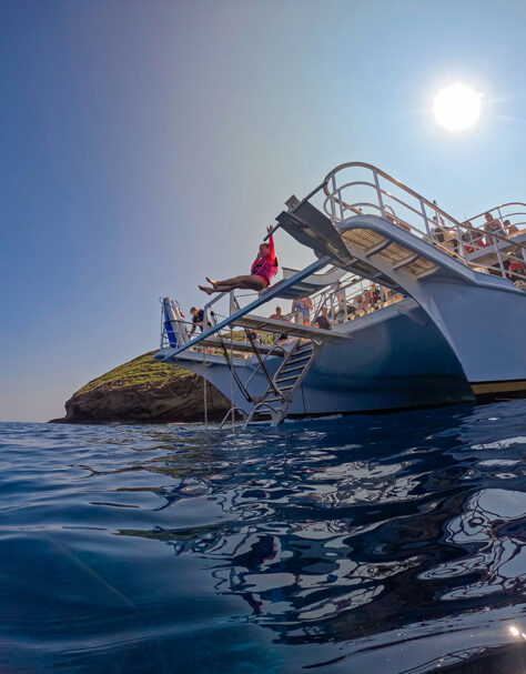 Child using the water slide at Molokini on Pride of Maui